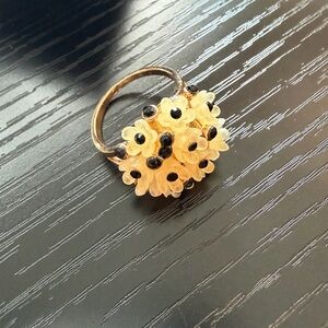 Chic Gold Floral Ring with Black Details